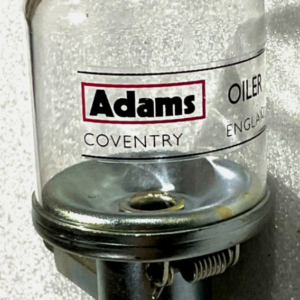 Imagen del lubricador Genuine Adams Oiler ACL7561, componente utilizado en sistemas industriales para suministrar aceite de forma controlada y mejorar el rendimiento y la durabilidad de maquinaria.